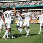 Real Madrid holds off hard-charging Borussia Dortmund to earn semi-final berth